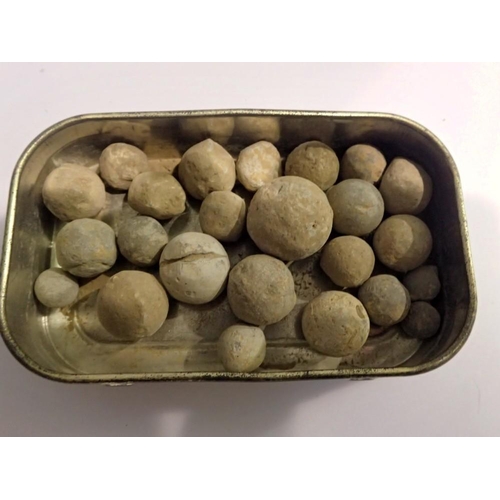 1081 - Tin of English civil war musket balls. UK P&P Group 1 (£16+VAT for the first lot and £2+VAT for subs... 