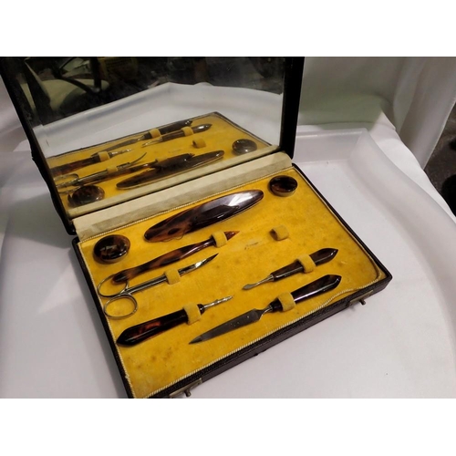 1088 - Faux Tortoiseshell manicure set with mirrored lid. UK P&P Group 1 (£16+VAT for the first lot and £2+... 