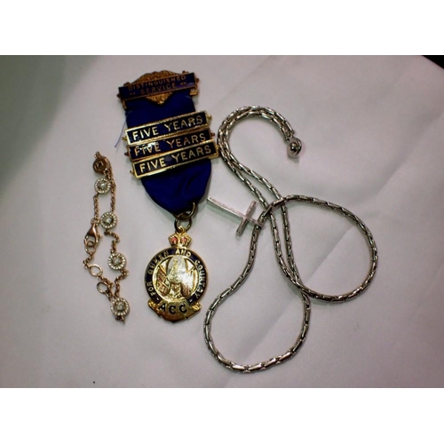 1158 - ACC distinguished Service Medal, with three 5 years clasps, a white metal cross and chain and a silv... 