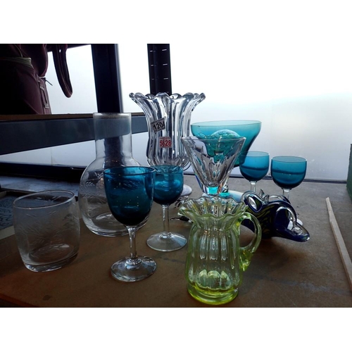 1204 - Shelf of assorted glassware including four coloured glass goblets, Uranium glass jug, large clear gl... 