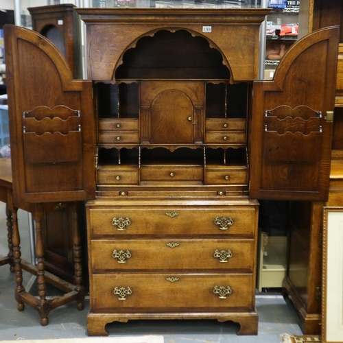 2169 - 20th century fitted writing desk by Tudor Oak having two arched doors above three long drawers, 89 x... 