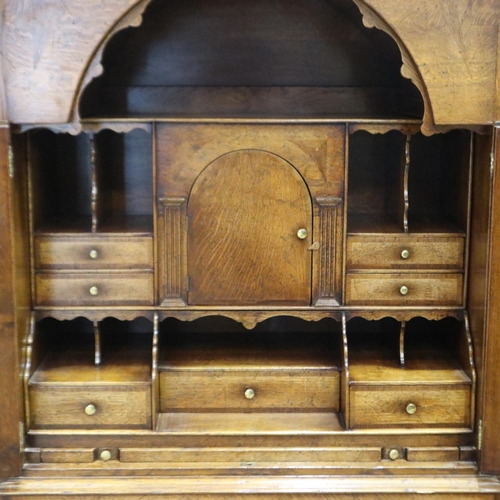 2169 - 20th century fitted writing desk by Tudor Oak having two arched doors above three long drawers, 89 x... 