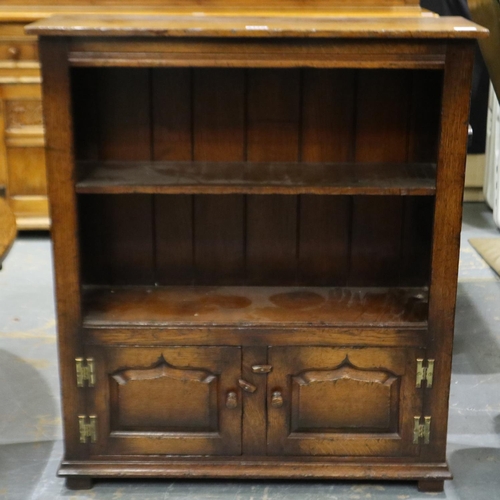 2178 - 20th century oak open bookcase with two panelled cupboard doors below, 84 x 27 x 97 cm H. Not availa... 