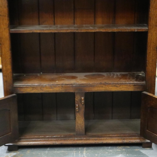 2178 - 20th century oak open bookcase with two panelled cupboard doors below, 84 x 27 x 97 cm H. Not availa... 