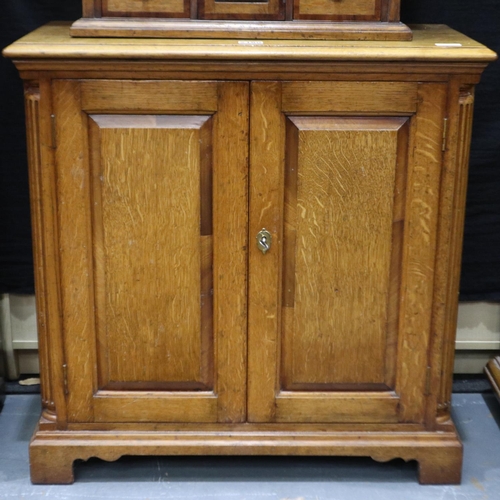 2180 - Golden oak two door cupboard with fluted columns, 76 x 36 x 75 cm H. Not available for in-house P&P