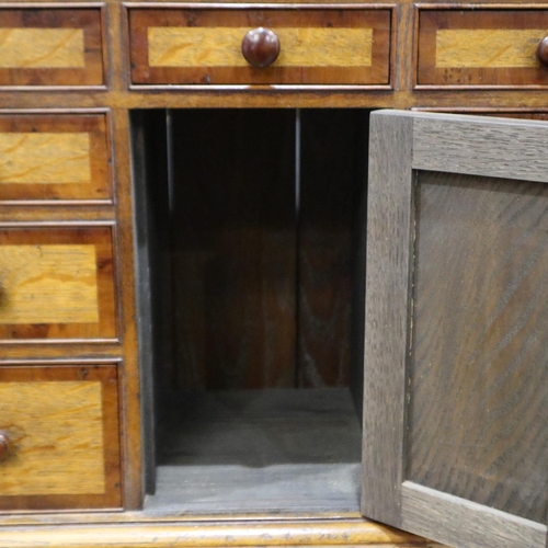 2192 - A crossbanded oak wall-mounting spice cabinet, comprising drawers and locking cupboard, 60 x 26 x 78... 