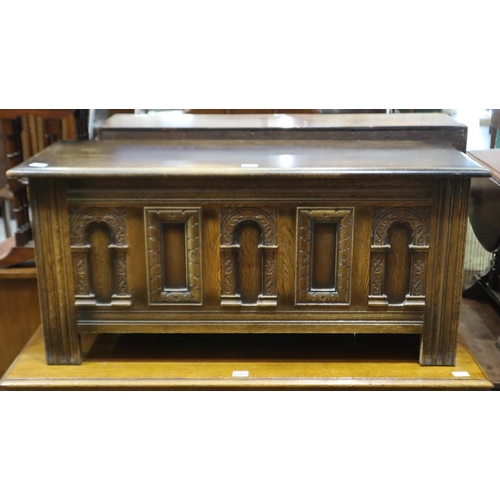 2195 - An oak panelled and carved chest with hinged lid, in the Old Charm manner, 114 x 44 x 52cm H, wear t... 