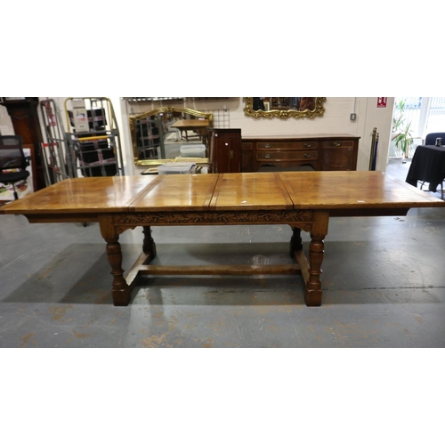 2196 - Substantial oak extending dining table, the frieze carved with designs of acorns in the Tudor manner... 