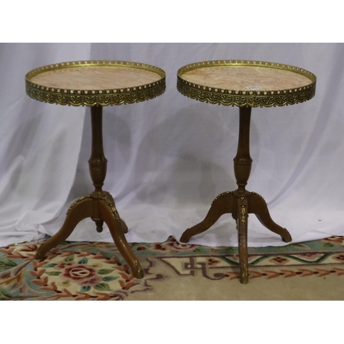 2203 - A pair of reproduction kingwood tripod wine tables, each with a rouge marble top and brass gallery, ... 