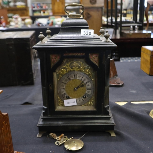 330 - Ebony and brass bracket clock, key and pendulum present, no pendulum hanger, clock is fully wound or... 