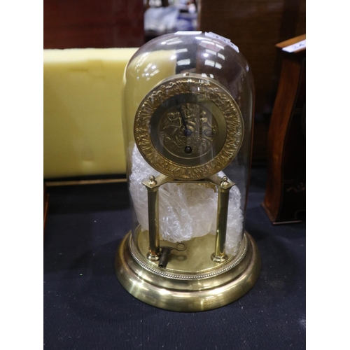 339 - Brass Anniversary clock with a figural dial in a glass dome. Not available for in-house P&P