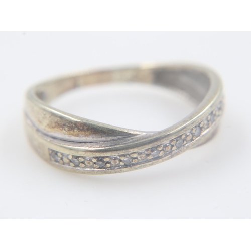 83 - 9ct gold crossover ring set with diamonds, size L, 2.1g. UK P&P Group 0 (£6+VAT for the first lot an... 