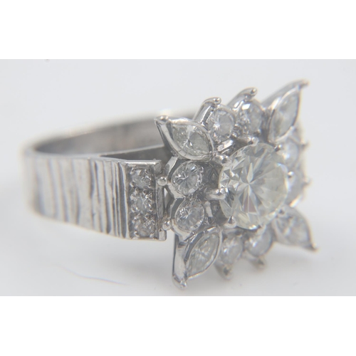 94 - Large heavy gauge diamond-set platinum cocktail ring, the central cushion-cut stone approximately 1.... 