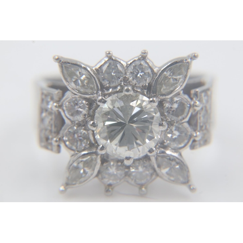 94 - Large heavy gauge diamond-set platinum cocktail ring, the central cushion-cut stone approximately 1.... 