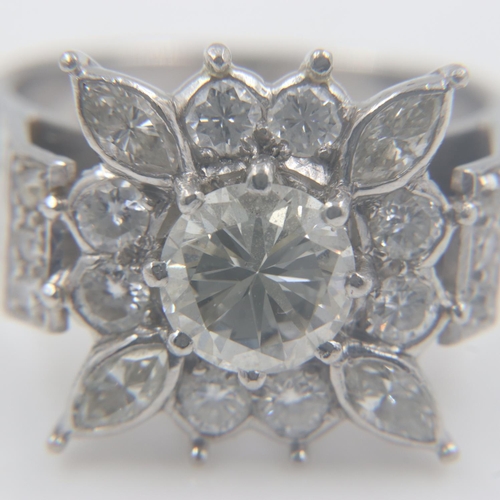 94 - Large heavy gauge diamond-set platinum cocktail ring, the central cushion-cut stone approximately 1.... 