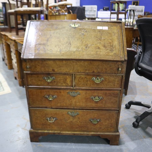 2147 - *KEYS IN OFFICE* An early 18th century walnut bureau, with stepped fitted interior, two short above ... 