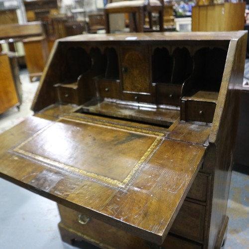 2147 - *KEYS IN OFFICE* An early 18th century walnut bureau, with stepped fitted interior, two short above ... 