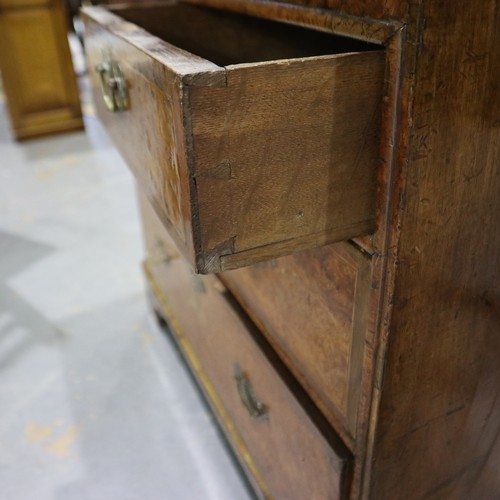 2147 - *KEYS IN OFFICE* An early 18th century walnut bureau, with stepped fitted interior, two short above ... 