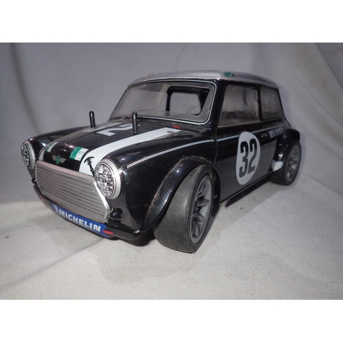 2031 - Tamiya radio controlled Mini Cooper fitted with pull start FS 12 Glow engine (good compression), ver... 