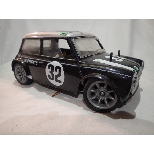 2031 - Tamiya radio controlled Mini Cooper fitted with pull start FS 12 Glow engine (good compression), ver... 