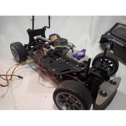 2031 - Tamiya radio controlled Mini Cooper fitted with pull start FS 12 Glow engine (good compression), ver... 