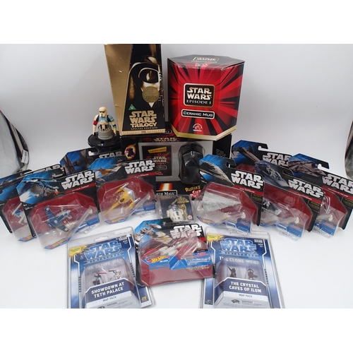 2114 - Nine boxed Star Wars Hot Wheels, two boxed Clone Wars D20 miniatures, a mug, VHS trilogy set, and a ... 