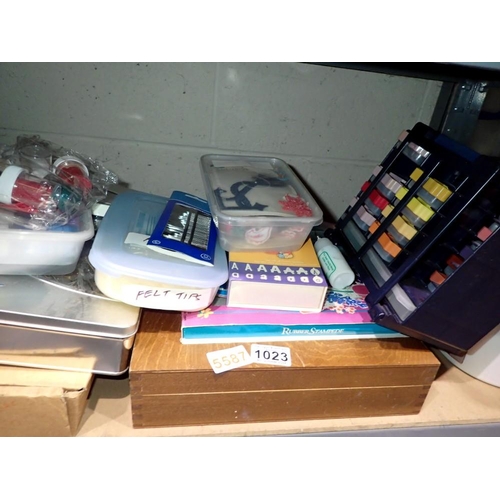 1023 - Shelf of art and crafting equipment and accessories including an artist box with oil paints (used). ... 