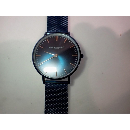 1065 - Elie Beaumont wristwatch on a blue stainless steel strap, requires battery. UK P&P Group 1 (£16+VAT ... 