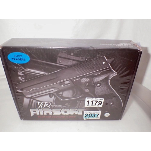 1179 - New old stock V12 airsoft pistol, in brown. UK P&P Group 1 (£16+VAT for the first lot and £2+VAT for... 