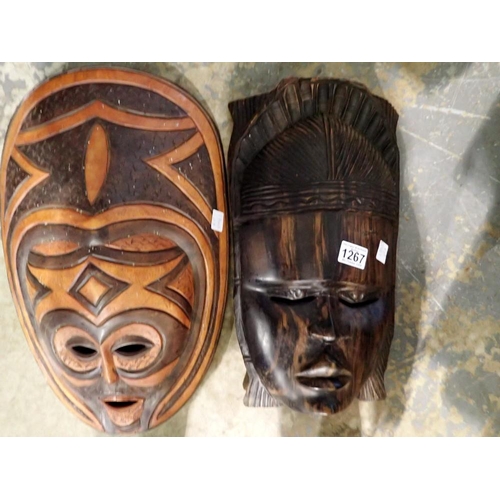 1267 - Two carved African masks. Not available for in-house P&P