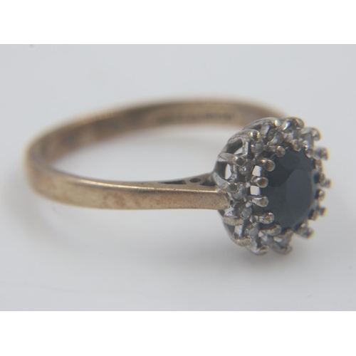 23 - 9ct gold cocktail ring set with sapphires and diamonds, size M/O, 2.4g. UK P&P Group 0 (£6+VAT for t... 