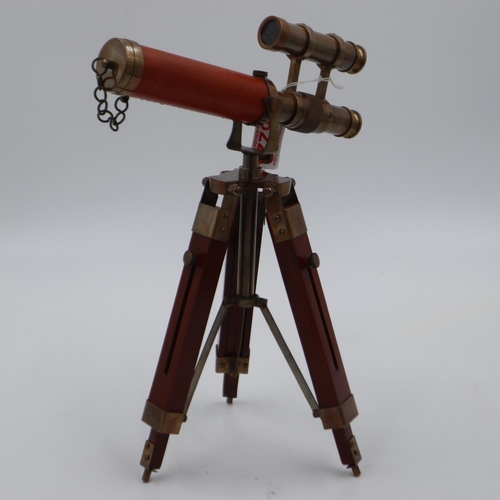 101 - Brass and leather telescope on wooden stand, H: 37 cm. UK P&P Group 3 (£30+VAT for the first lot and... 