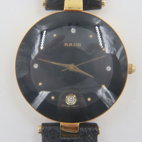 61 - Rado: ladies gold plated wristwatch with date aperture, on leather strap, requires battery. UK P&P G... 