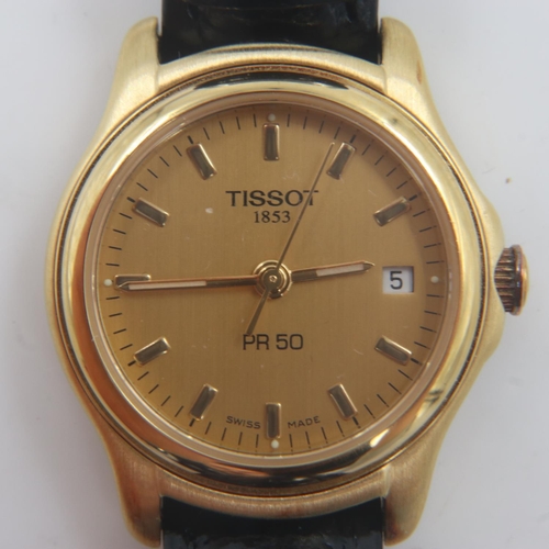 64 - Tissot: ladies gold plated PR50 quartz wristwatch, gold tone dial with date aperture on a black leat... 