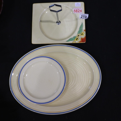 210 - Three pieces of Bizarre by Clarice Cliff including a Biarritz cake plates, ribbed oval platter and a... 