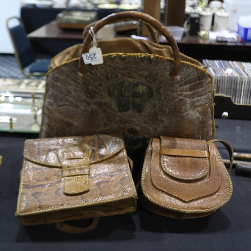 250 - Three vintage bags, large crocodile bag with a snakeskin handbag and a lizard skin handbag. Not avai... 