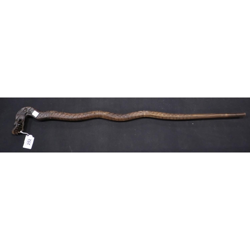 252 - Ornately carved Oriental hardwood walking stick with dragon head handle, L: 98 cm. Not available for... 