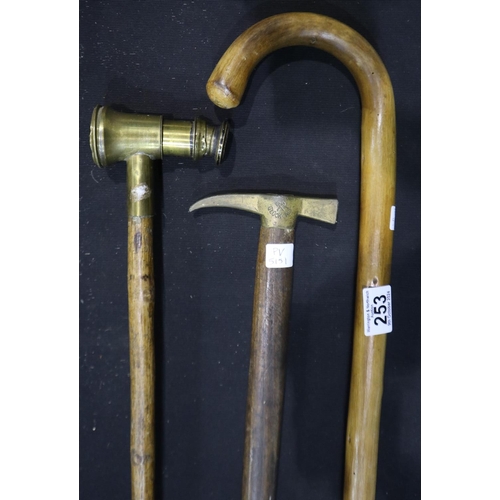 253 - Three walking sticks, including a telescope handled example. UK P&P Group 3 (£30+VAT for the first l... 