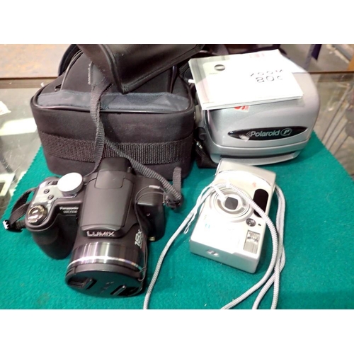 1191 - Three cameras including a vintage Polaroid. Not available for in-house P&P