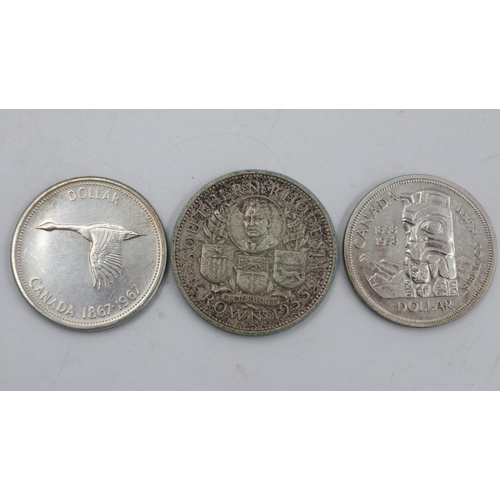 2091 - 1958 and 1967 Canada silver dollars and a Southern Rhodesia 1953 crown. UK P&P Group 0 (£6+VAT for t... 