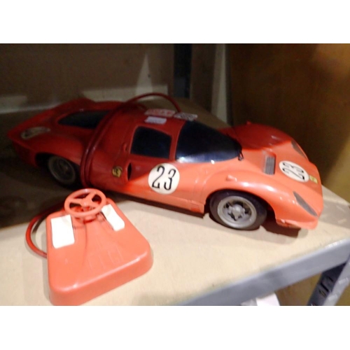 1030 - Vintage battery operated Ferrari model car with corded remote. Not available for in-house P&P