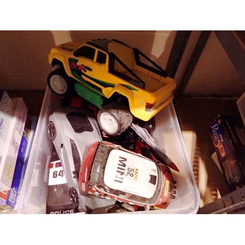 1037 - Box of various remote controlled cars with controllers. Not available for in-house P&P