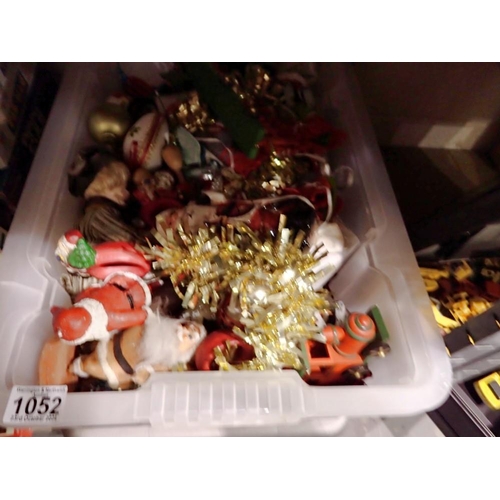 1052 - Plastic container full of Christmas decorations. Not available for in-house P&P