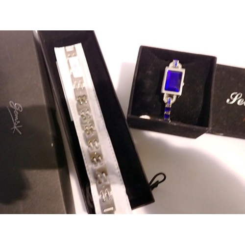 1091 - Secret quartz and blue stone wristwatch and Gems diamond/titanium bracelet. Not available for in-hou... 