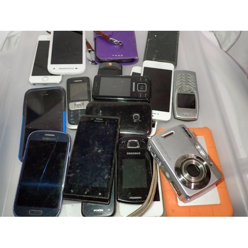 1111 - Tray of various mobile phones to include iPhone examples and a Sony Cybershot digital camera. UK P&P... 