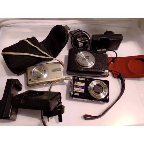 1160 - Three Fujifilm cameras, with chargers and instructions. UK P&P Group 2 (£20+VAT for the first lot an... 