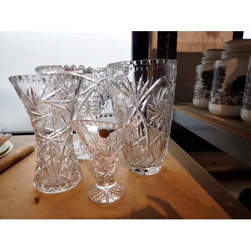 1253 - Group of four crystal vases, largest H: 25 cm. Not available for in-house P&P