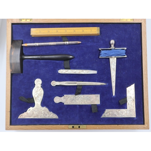 105 - Set of silver plated Masonic Lodge Working Tools, set within a velvet lined fitted oak box. UK P&P G... 