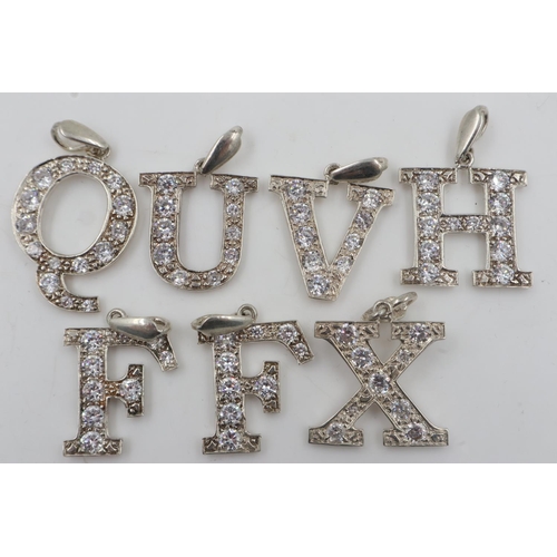 15 - Seven 925 silver stone set letter pendants. UK P&P Group 0 (£6+VAT for the first lot and £1+VAT for ... 