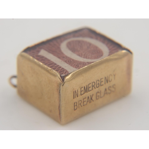 55 - 9ct gold cased 10 shilling note charm, 2.4 grams. UK P&P Group 0 (£6+VAT for the first lot and £1+VA... 